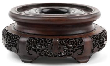 Chinese carved and pierced hardwood stand, 20cm in diameter