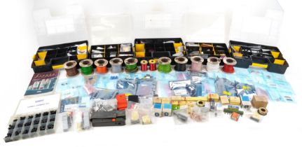 Large collection of electrical components, predominantly transistors, resistors and rolls of wire