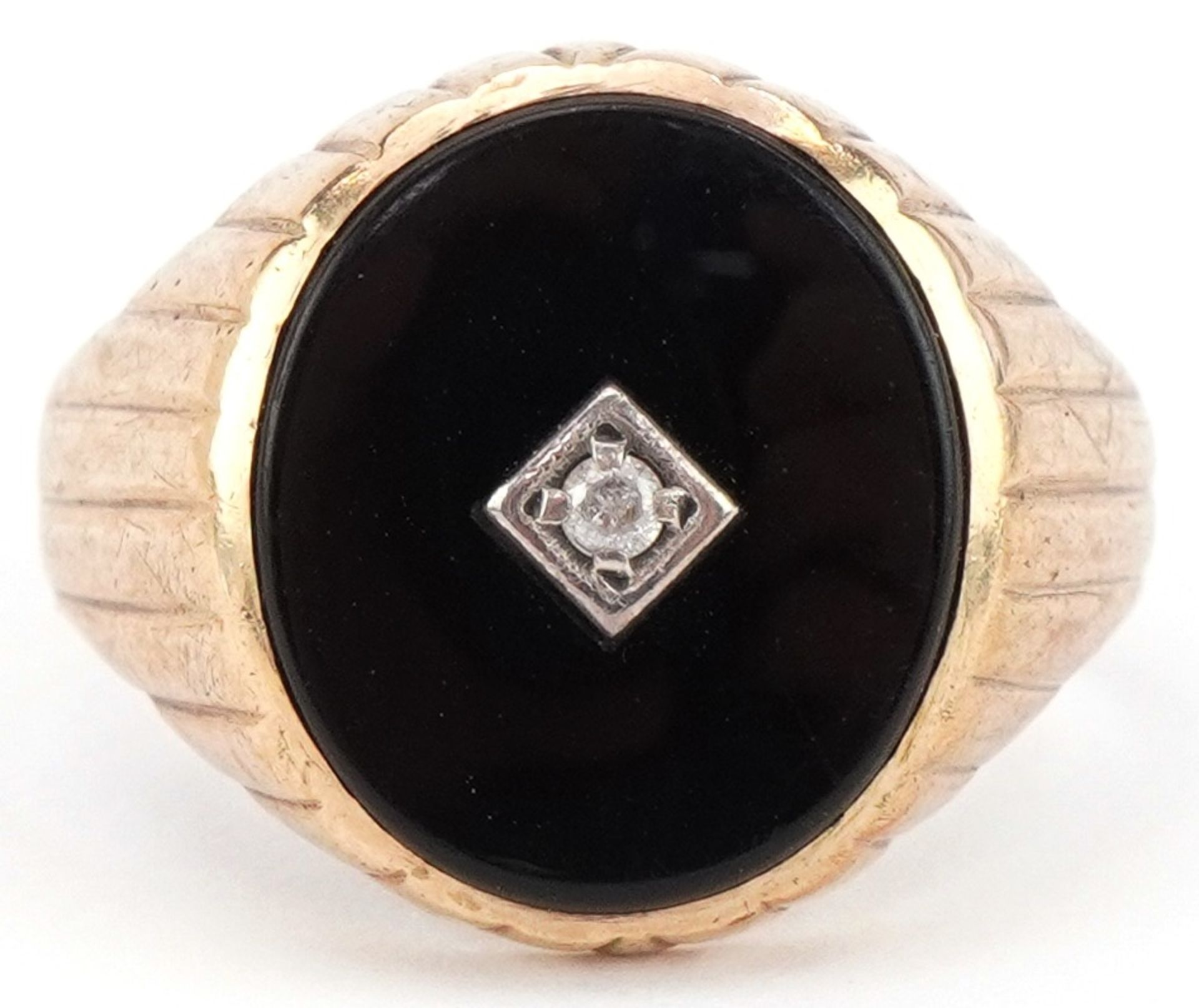 9ct gold black onyx signet ring set with a clear stone, size R, 5.0g