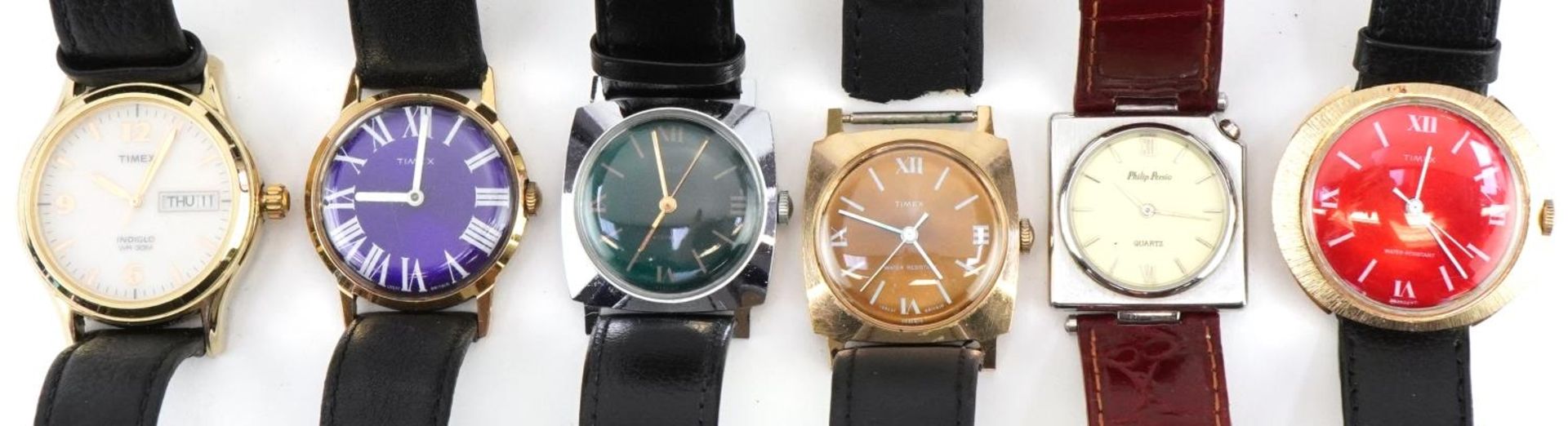 Five vintage and later Timex wristwatches and a Philip Persio wristwatch, the largest 34mm wide