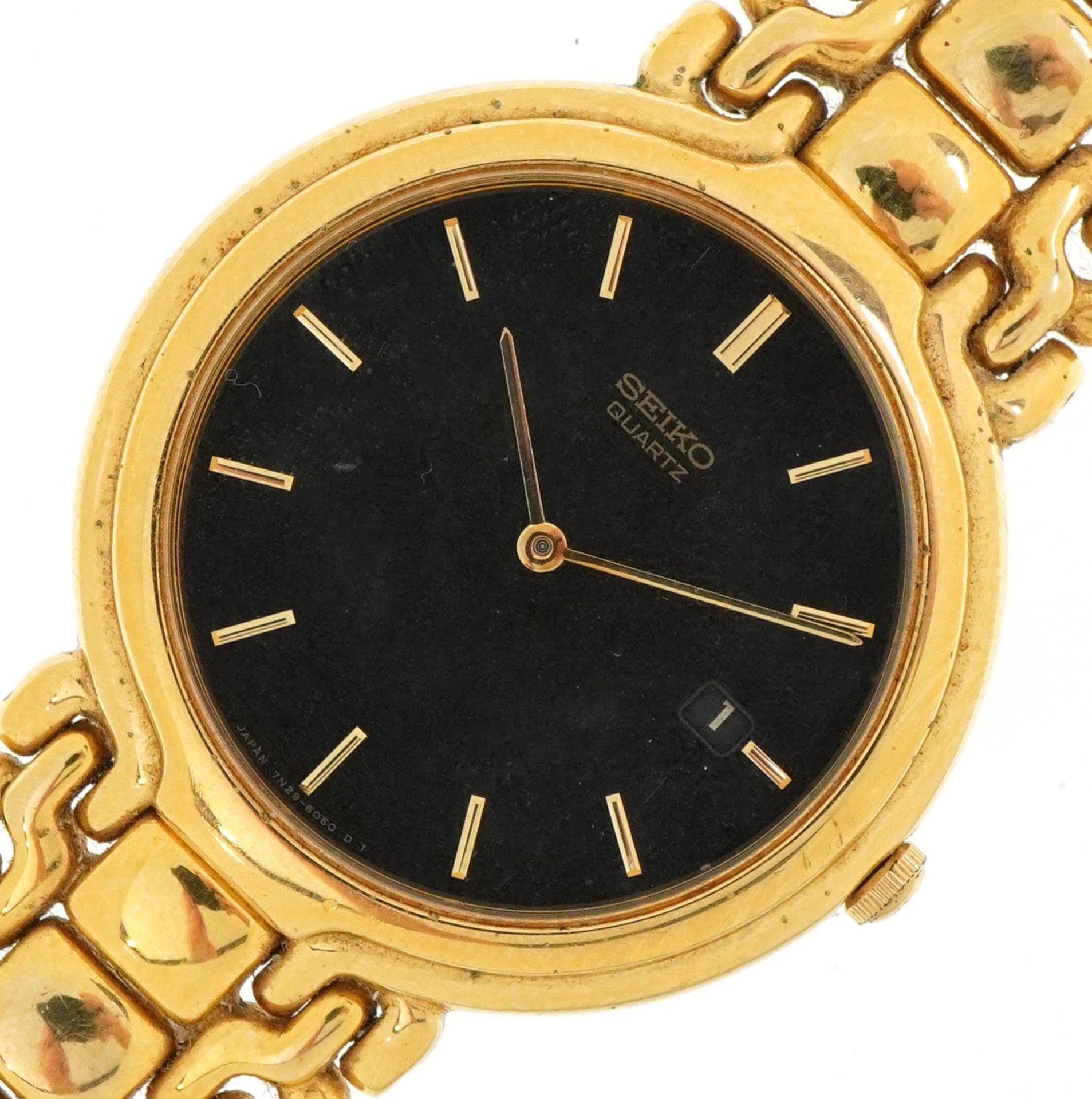 Seiko, gentlemen's gold plated Seiko 6030 quartz wristwatch having black dial with date aperture,