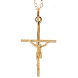 9ct gold crucifix pendant on a 9ct gold necklace, 3cm high and 40cm in length, total 1.0g