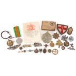 Assorted military interest cap badges including Argyll & Sutherland, military watch chain, patches