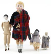 Bisque headed Scottish doll together with a German china headed doll and two miniature dolls, the