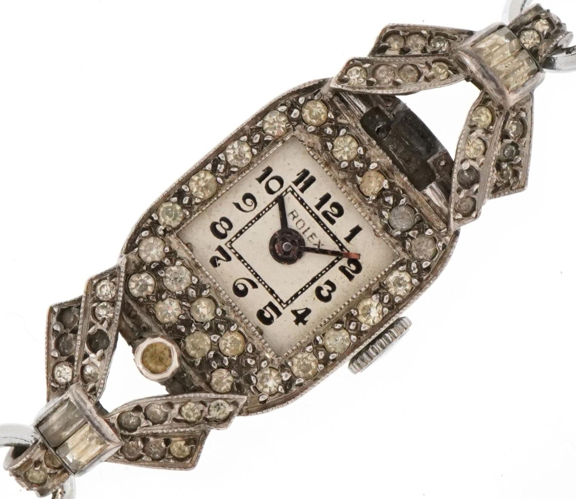 Art Deco ladies clear stone manual wind wristwatch having silvered dial with Arabic numerals