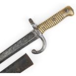 French military interest bayonet with scabbard and steel blade, 71cm in length