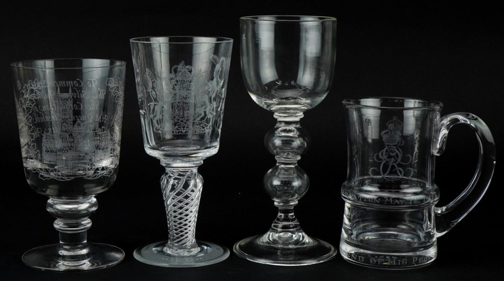 Four glasses including Elizabeth II Queen's Silver Jubilee goblet with air twist stem, the largest