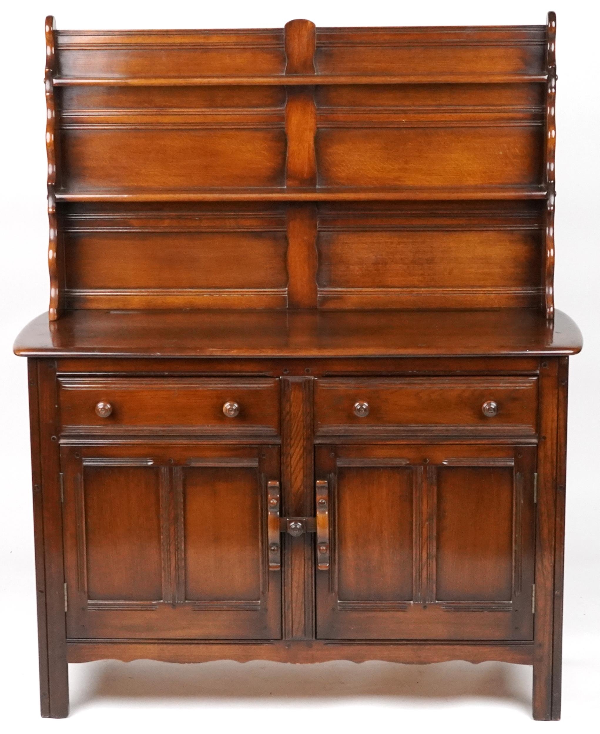 Ercol elm dresser with open plate rack above a pair of drawers and pair of cupboard doors, 154cm H x - Image 2 of 4