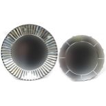 Two contemporary wall hanging mirrors, the largest 61cm in diameter
