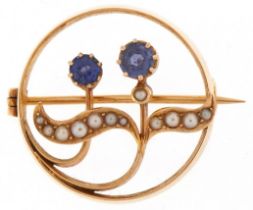 Art Nouveau 15ct gold sapphire and seed pearl floral brooch, 2.5cm in diameter, 6.0g