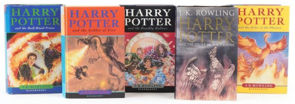 Five Harry Potter hardback books with dust jackets including Harry Potter and the Half-Blood
