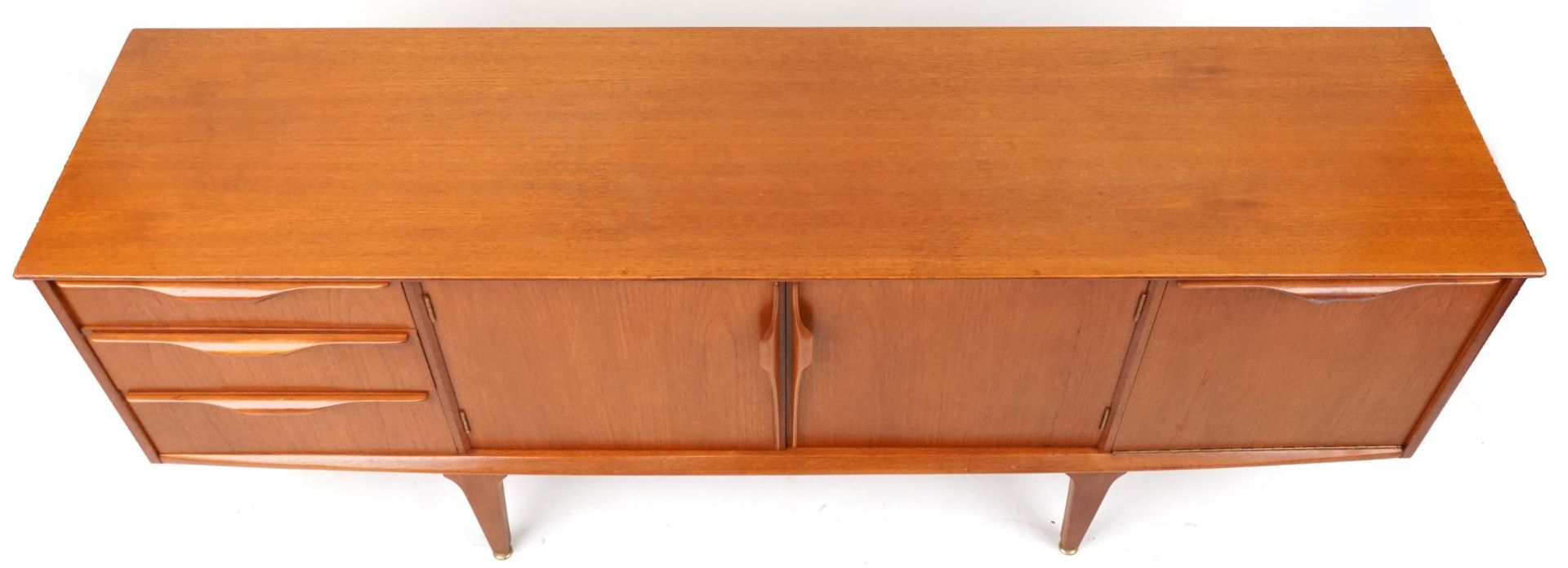 Mackintosh, mid century Scottish teak sideboard fitted with an arrangement of three drawers and - Image 2 of 3