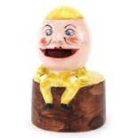 Early 20th century Carlton Ware stamp licker in the form of Humpty Dumpty, registered number to