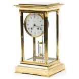 French brass four glass L'Épée mantle clock with enamelled dial and mercury pendulum, 34cm high