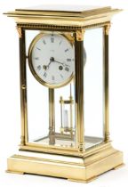 French brass four glass L'Épée mantle clock with enamelled dial and mercury pendulum, 34cm high