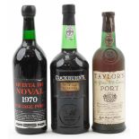 Three bottles of port comprising Taylor's 20 Years Old Tawny port, Cockburn's Special Reserve and