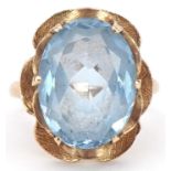 9ct gold blue topaz flower head ring, the topaz approximately 16.20mm x 12.60mm x 7.0mm deep, size