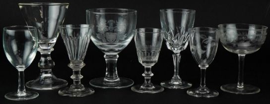 Eight antique and later wine glasses including a rummer with edged heraldic crest, the largest