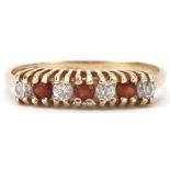 9ct gold garnet and clear stone half eternity ring, size L/M, 1.3g