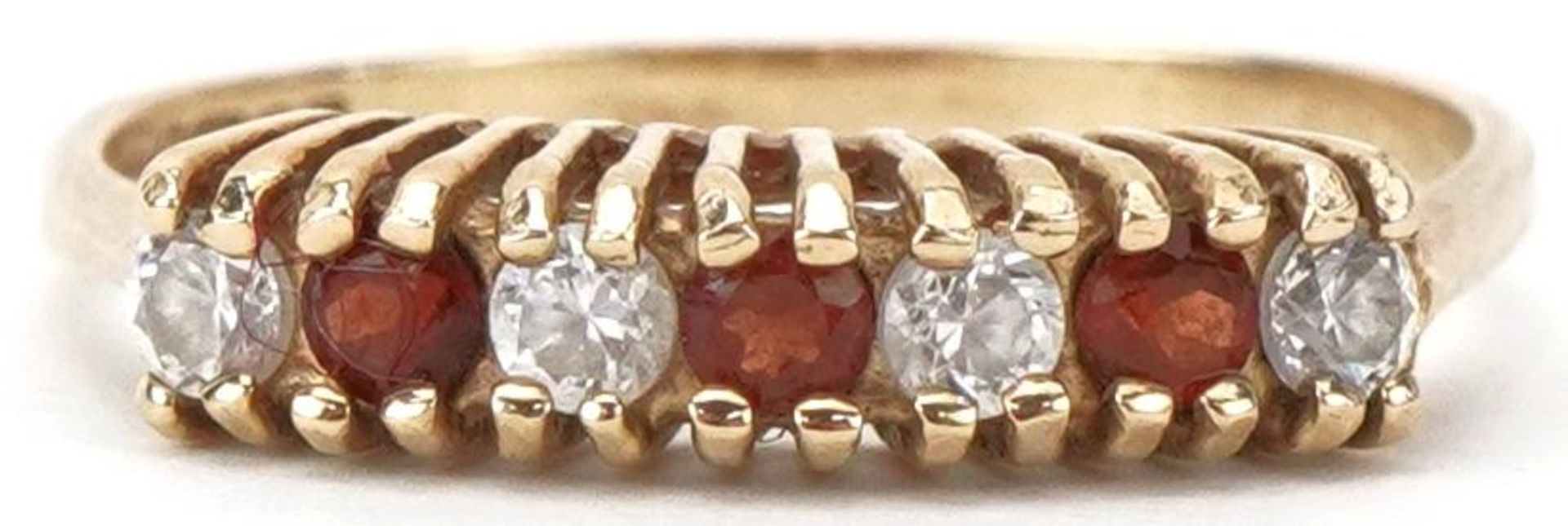 9ct gold garnet and clear stone half eternity ring, size L/M, 1.3g