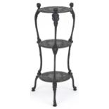 Victorian style cast iron three tier plant stand with figural mounts, 74cm high