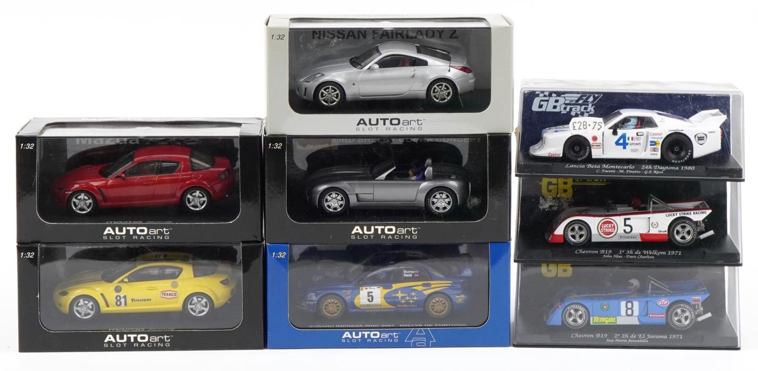Eight 1:32 scale model slot cars with boxes and cases including Fly Lancia Beta, Autoart Mazda RX8