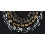 Four vintage and later necklaces including rock crystal and quartz, one with silver clasp, the