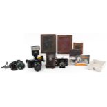Cameras and photography accessories including Nikon F3 camera with Nikor 85mm 1:1.4 lens and Nikon