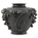 Japanese bronze vase relief moulded with grapes and vines, impressed signature to the base, 23cm