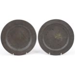 Pair of 18th century pewter plates, stamped Edward Ubly London marks, each 23cm in diameter