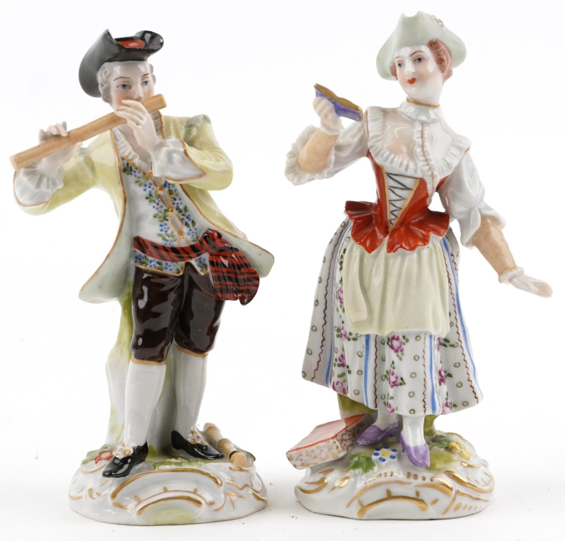 Pair of Dresden German porcelain figures of a female holding a book and a gentleman playing a flute,