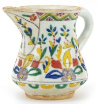 Turkish Ottoman Kutahya milk jug hand painted with stylised flowers, 11cm high