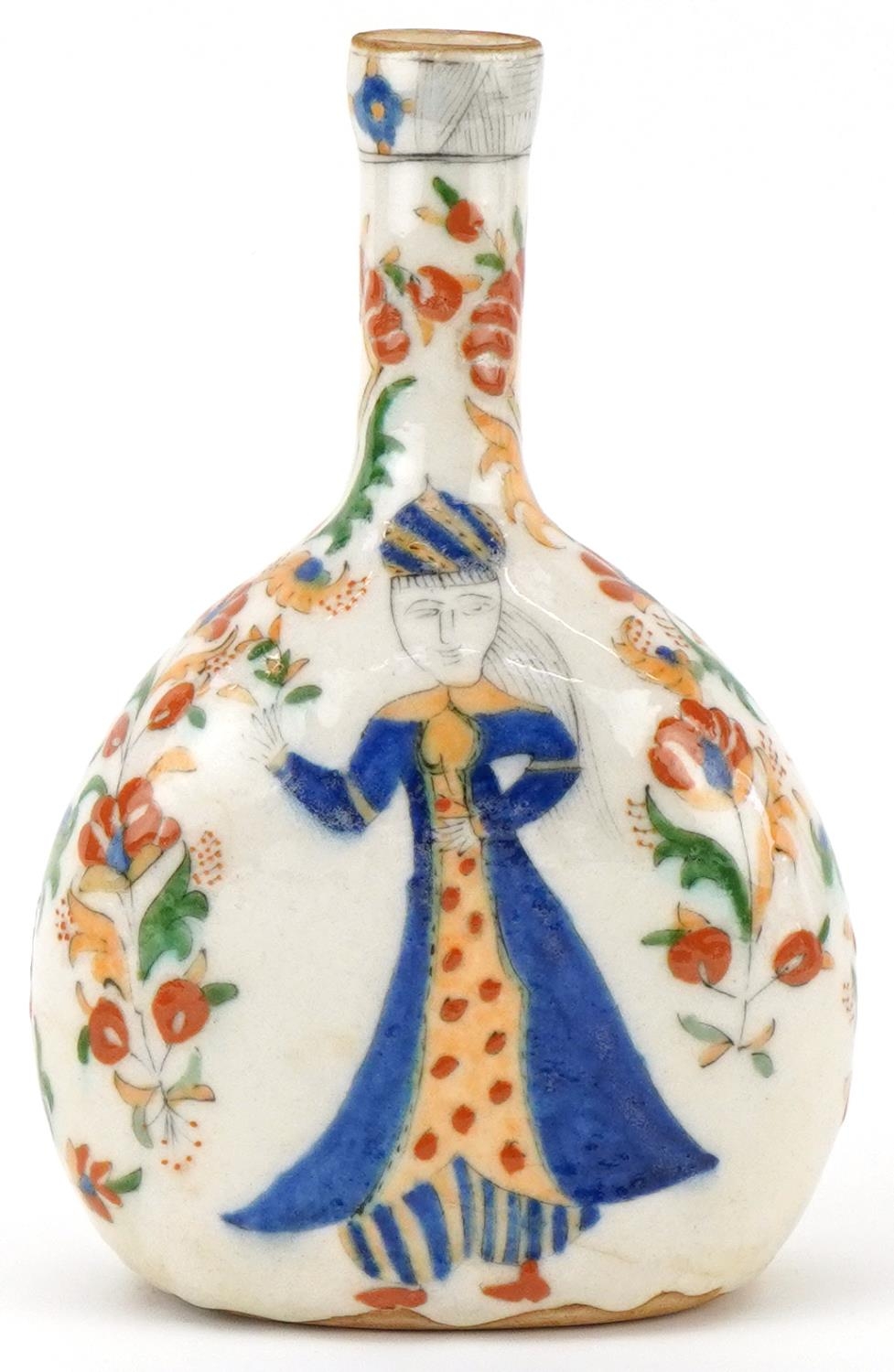 Turkish Ottoman Kutahya water flask hand painted with figures amongst flowers, 22cm high