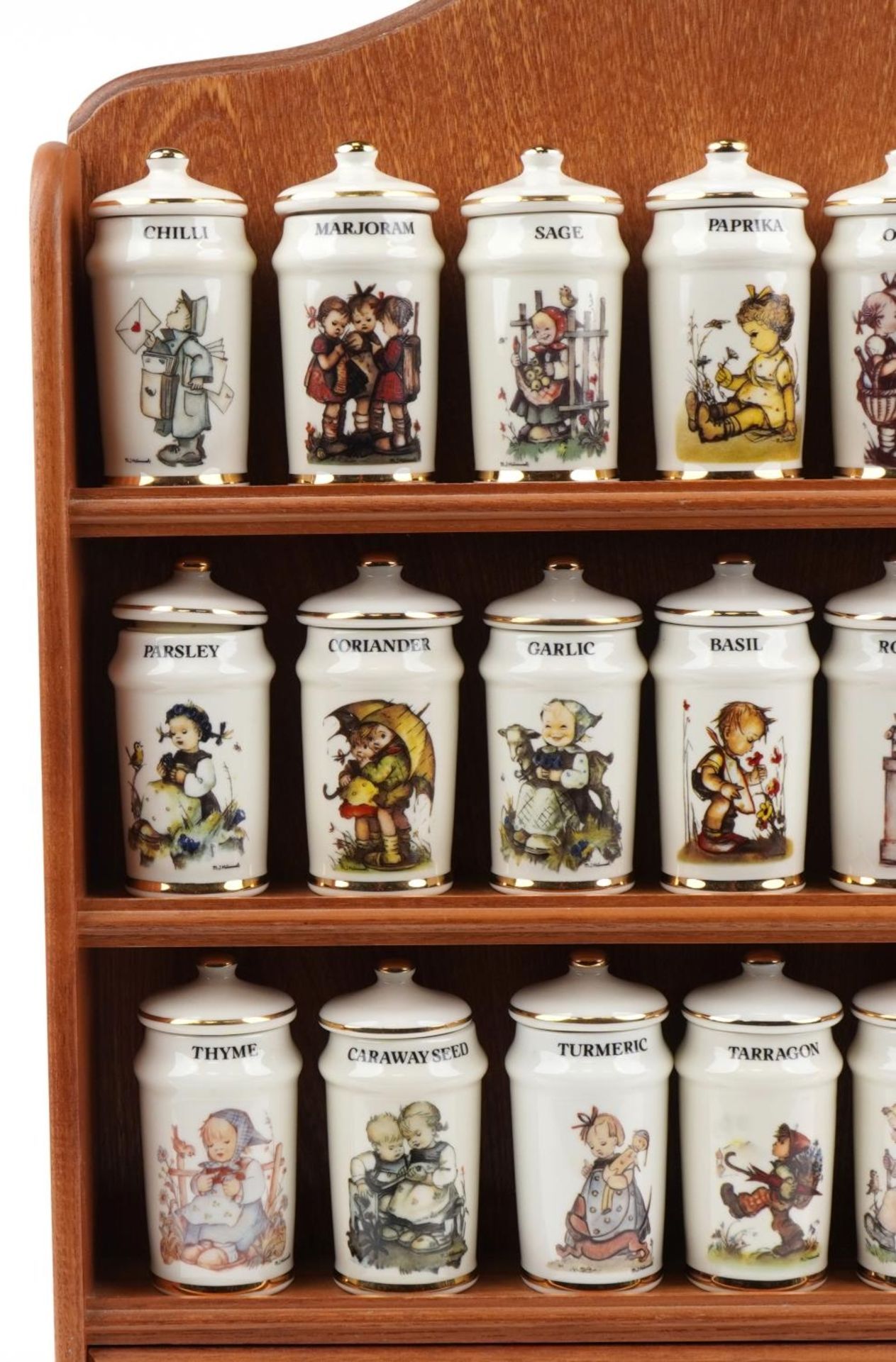 Collection of M J Hummel porcelain spice jars and covers arranged in a lightwood spice rack, each - Image 2 of 5