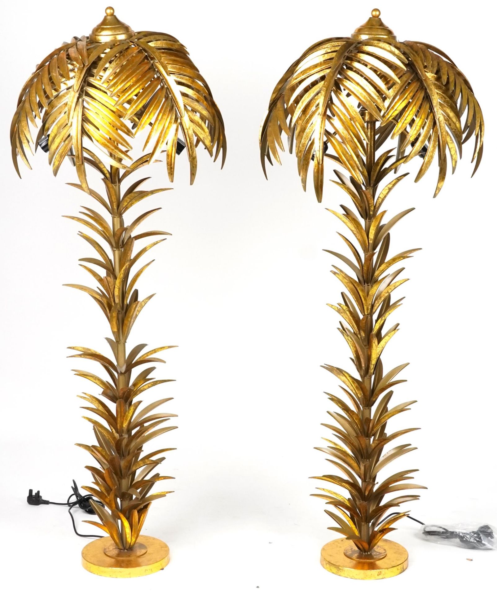 Pair of Hollywood Regency style gilt painted metal standard lamps in the form of palm trees, each