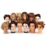 Collection of hairdresser's training mannequin heads including L'Image and hair tools