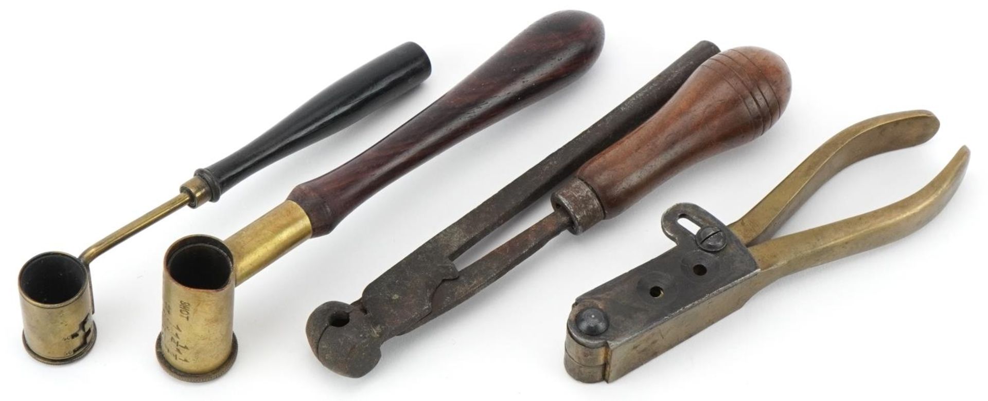 Two wooden and brass shotgun cartridge makers along with an wooden handled shot maker including an