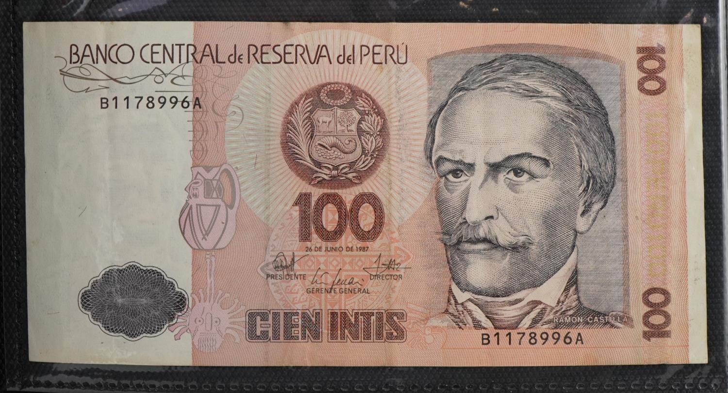 World banknotes arranged in an album including Bank of Scotland twenty pounds, Kenya, Indonesia - Image 2 of 10