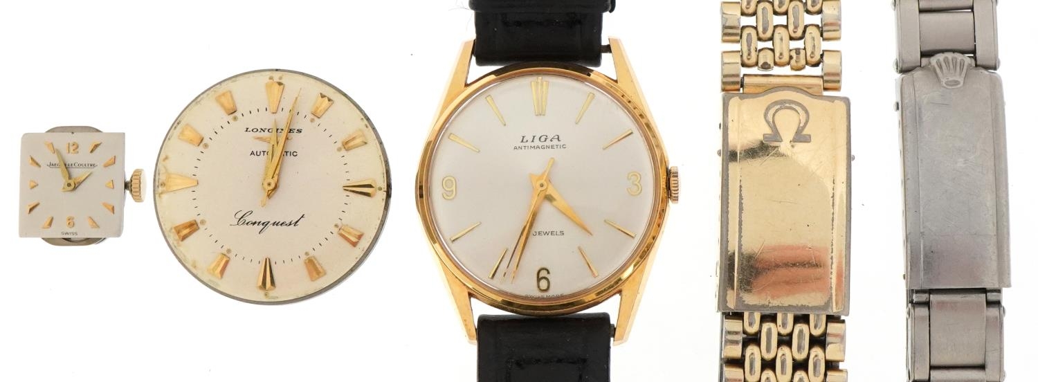 Vintage wristwatch parts including Omega watch strap, Jaeger LeCoultre ladies wristwatch movement