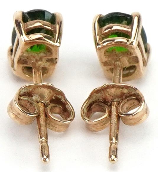 Pair of 9ct gold green stone solitaire stud earrings, possibly olivine, each 6.0mm high, total 0.8g - Image 2 of 2