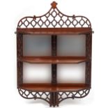 Mahogany wall hanging open fretwork wall hanging shelves with bevelled glass mirrored back, 84cm H x