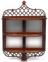 Mahogany wall hanging open fretwork wall hanging shelves with bevelled glass mirrored back, 84cm H x