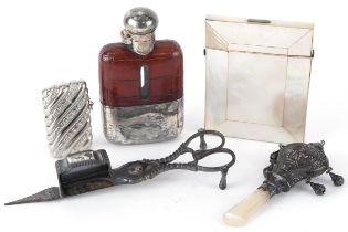 Mother of pearl card case, silver and leather hip flask, baby's rattle, vesta and candlesnuffers,