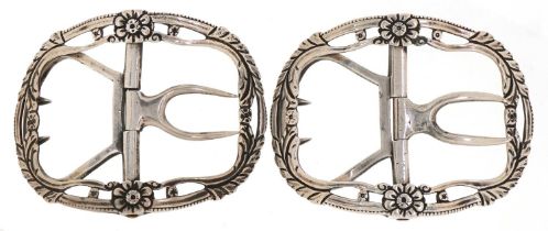 Charles Horner, two Georgian style silver belt buckles cast with stylised flowers, incomplete