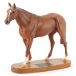 Beswick Connoisseur model of race horse Grundy raised on an oval plinth base, 35cm in length