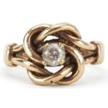 9ct gold knot design ring set with a clear stone, size P, 5.2g