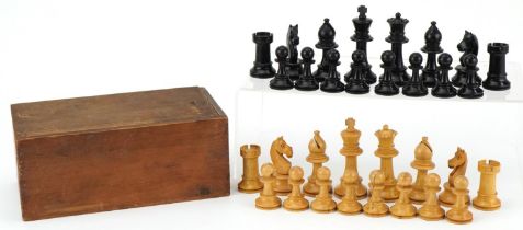 Boxwood and ebony Staunton pattern chess set housed in a pine case with slide lid, the largest