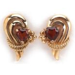 Pair of 9ct gold garnet love heart stud earrings, each 1.6cm high, total 2.4g