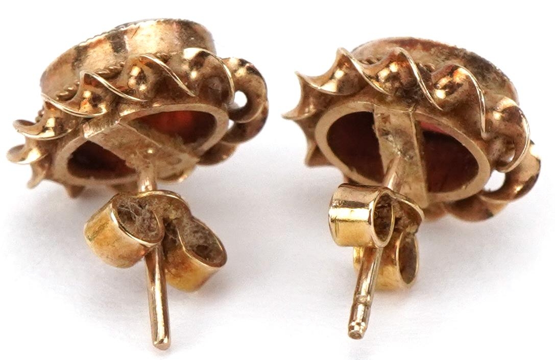 Pair of 9ct gold garnet stud earrings, each 1.1cm high, total 2.2g - Image 2 of 2