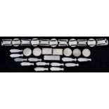 Chinese Canton mother of pearl gaming counters, some arranged on a belt including examples of